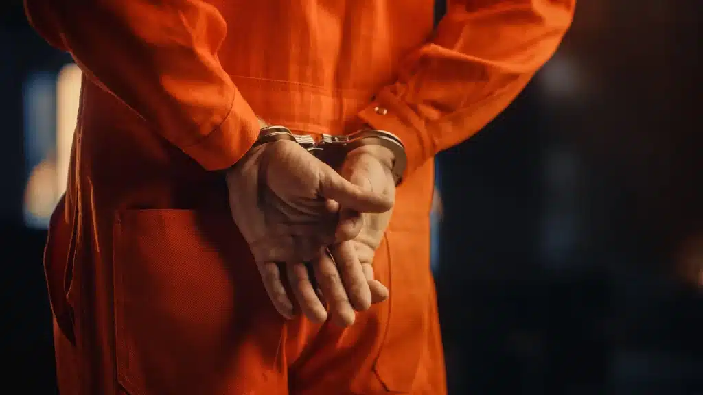 An inmate in handcuffs.
