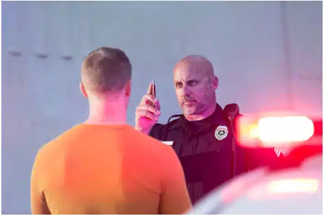 A police officer giving someone a DUI check.